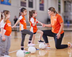 Woman coach with three girls